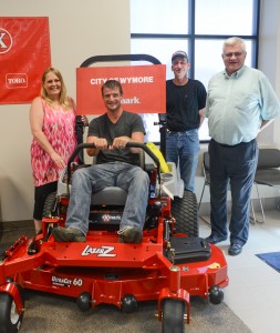 Representatives from the City of Wymore, Nebraska pose with the city's new Lazer Z E-Series mower.