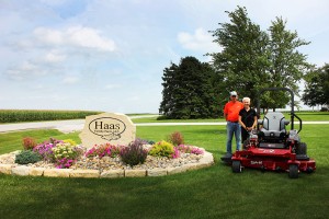Farm Beautiful contest grand prize winner, Richard Haas, poses with his wife and their new Exmark Lazer Z X-Series mower.