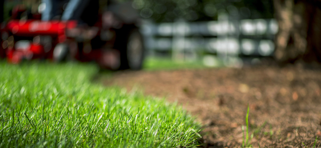 an exmark mower cutting a lawn