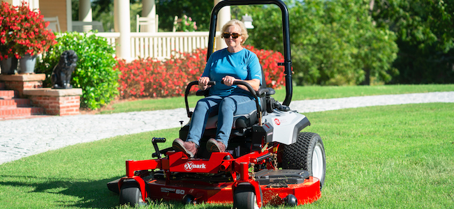 Radius X Series mowing a lawn in the spring